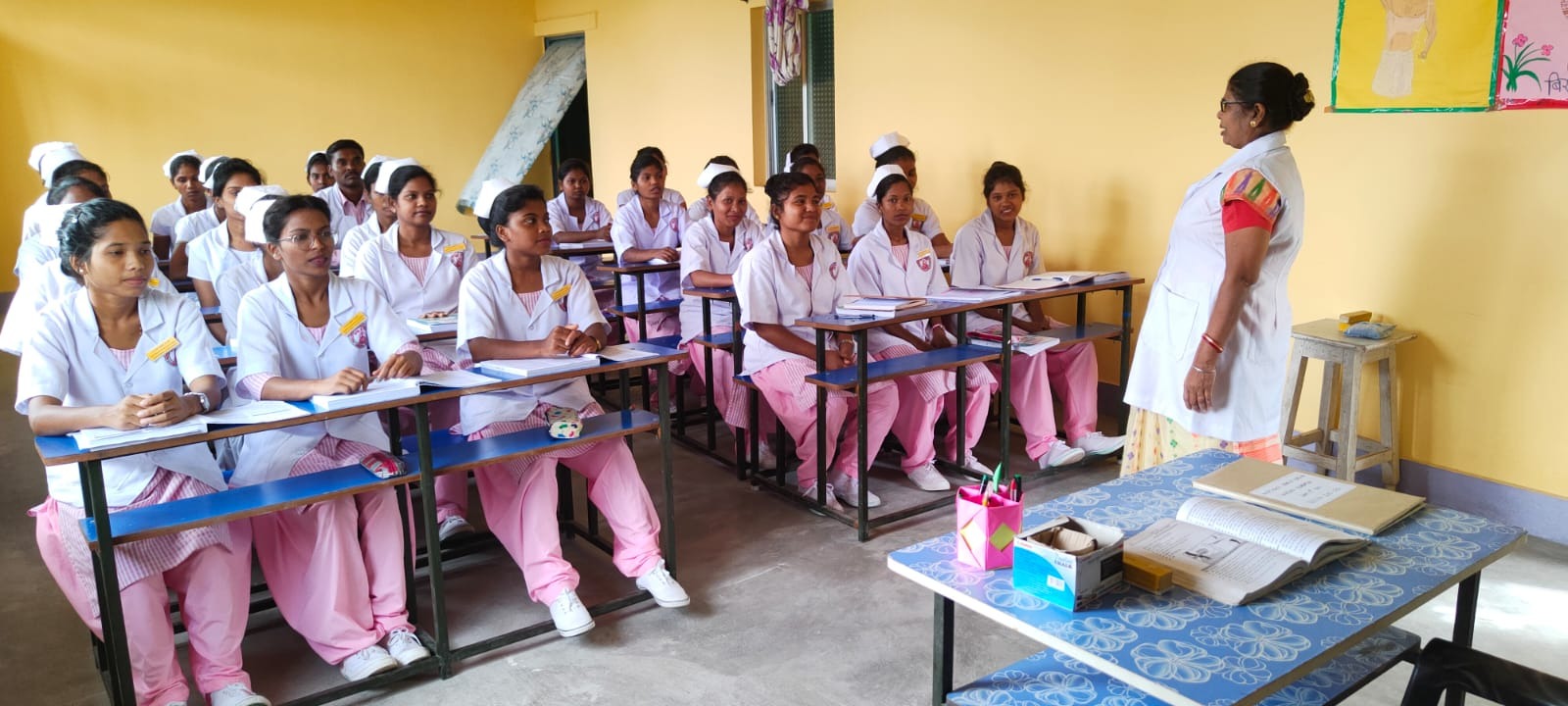 GNM Nursing students sitting in a classroom and learning